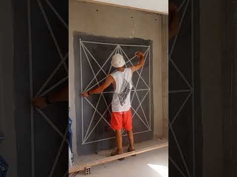 Crea un mural de pared con estampado geométrico y cinta adhesiva: Transforma una habitación con un diseño moderno