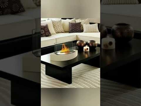 Crea una mesa de centro con una base de troncos de árbol y una tapa de cristal: Un toque rústico y elegante para tu sala de estar